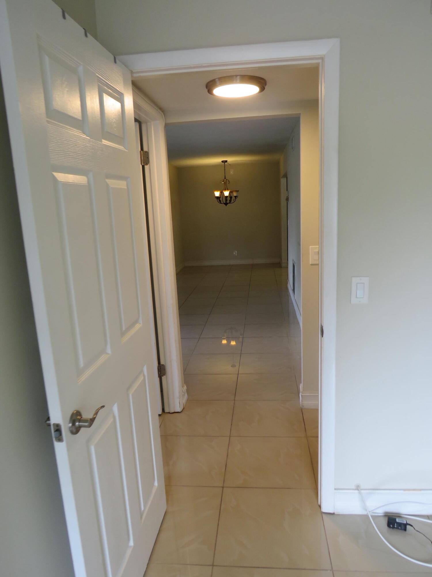 335 Pine Ridge Circle, Unit D1 Greenacres, FL 33463 - Photo 19 of 30 a view of a hallway