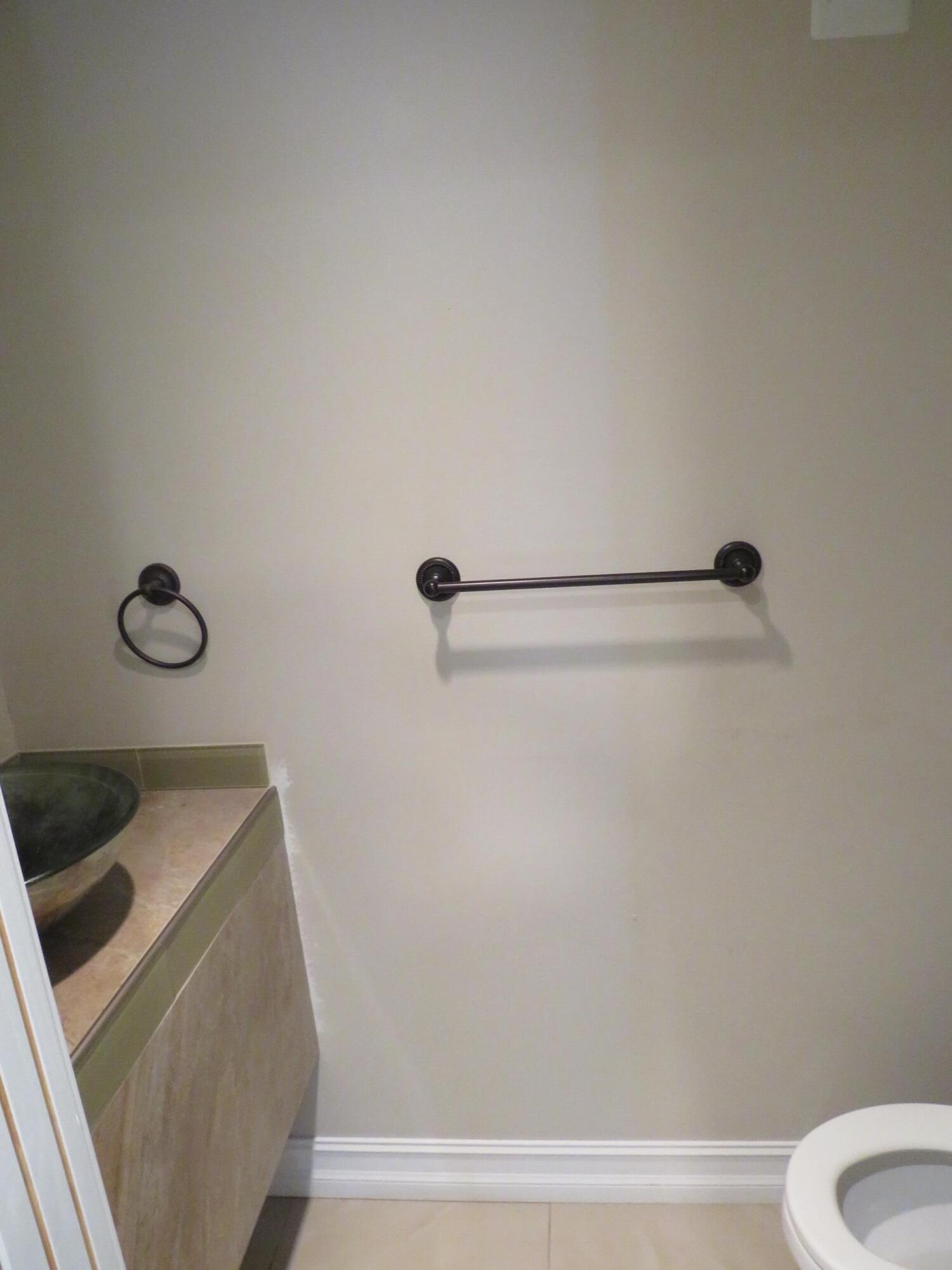 335 Pine Ridge Circle, Unit D1 Greenacres, FL 33463 - Photo 21 of 30 a bathroom with a sink toilet and shower