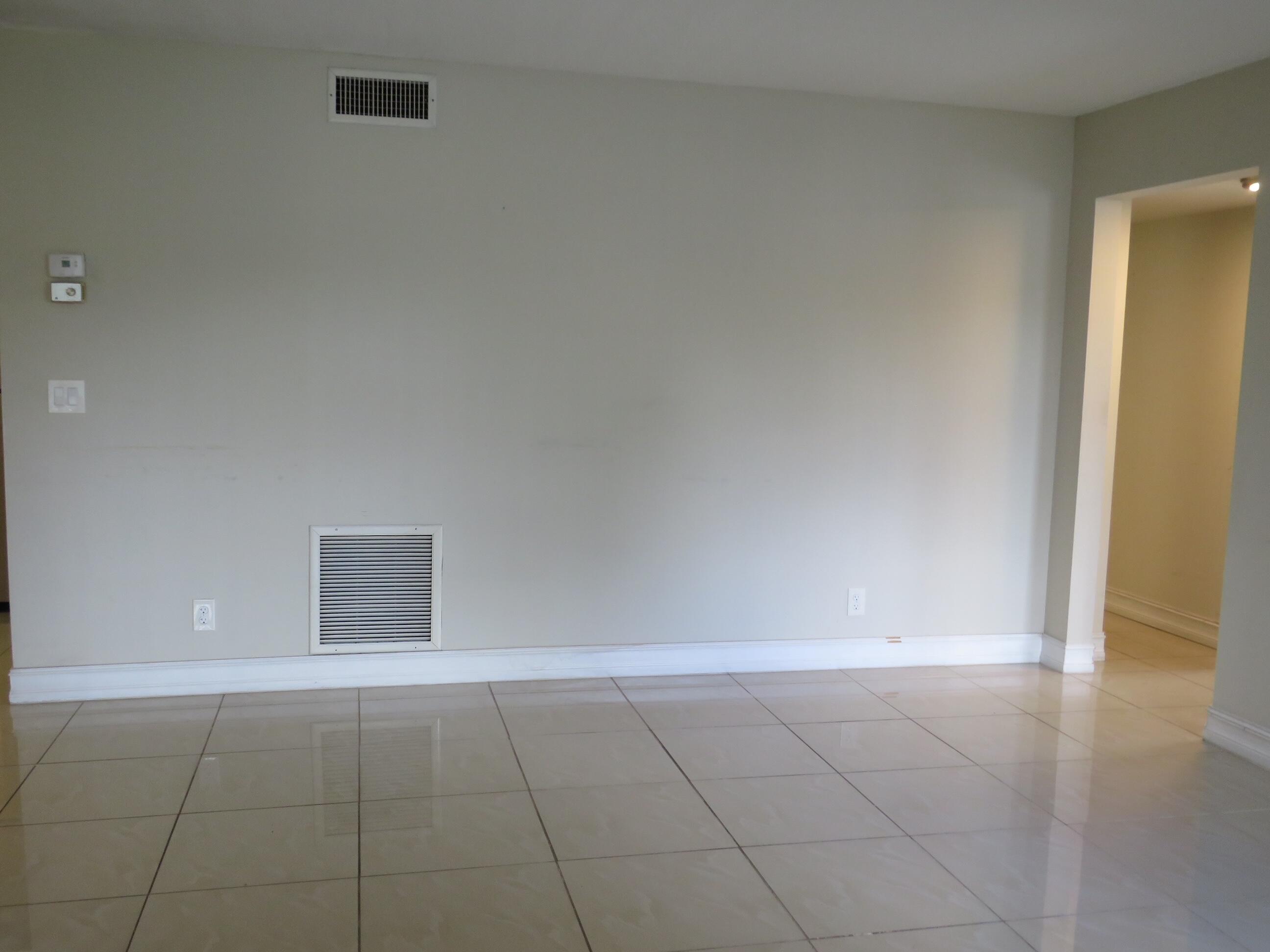 335 Pine Ridge Circle, Unit D1 Greenacres, FL 33463 - Photo 6 of 30 wooden floor in an empty room