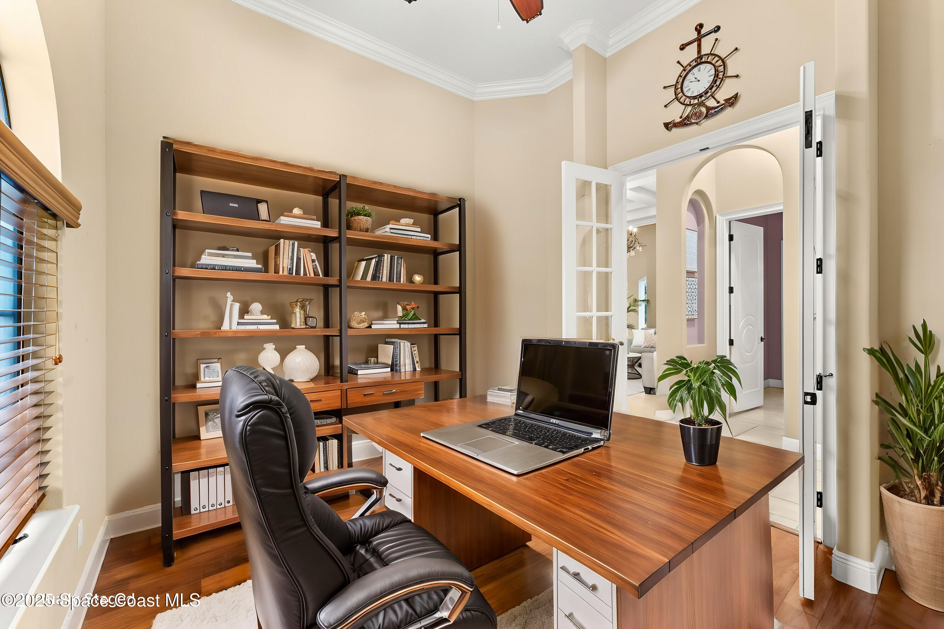 6205 Anello Drive Melbourne, FL 32940 - Photo 15 of 49 a view of a workspace with furniture and a potted plant