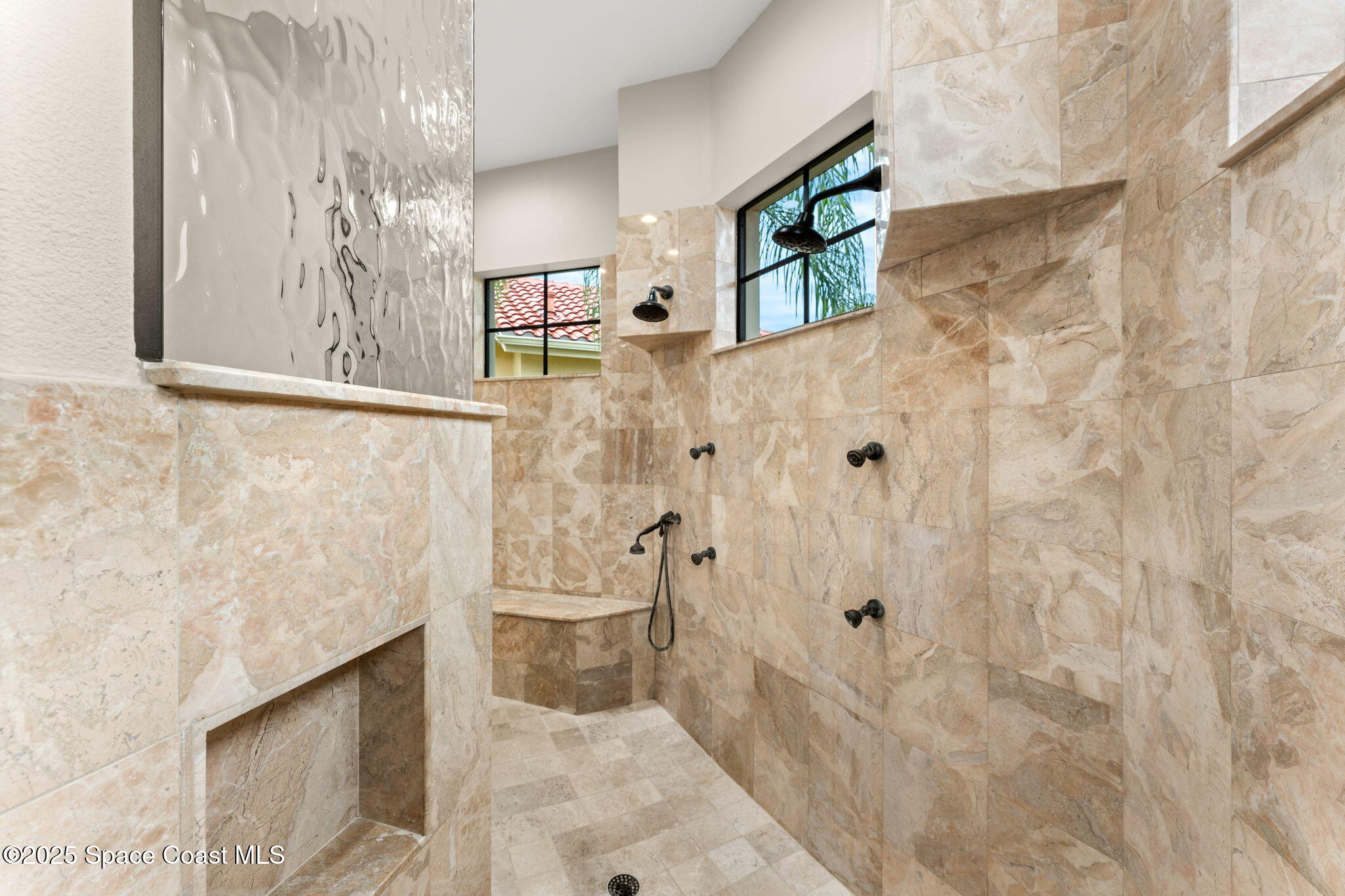 6205 Anello Drive Melbourne, FL 32940 - Photo 20 of 49 a bathroom with a shower and a toilet