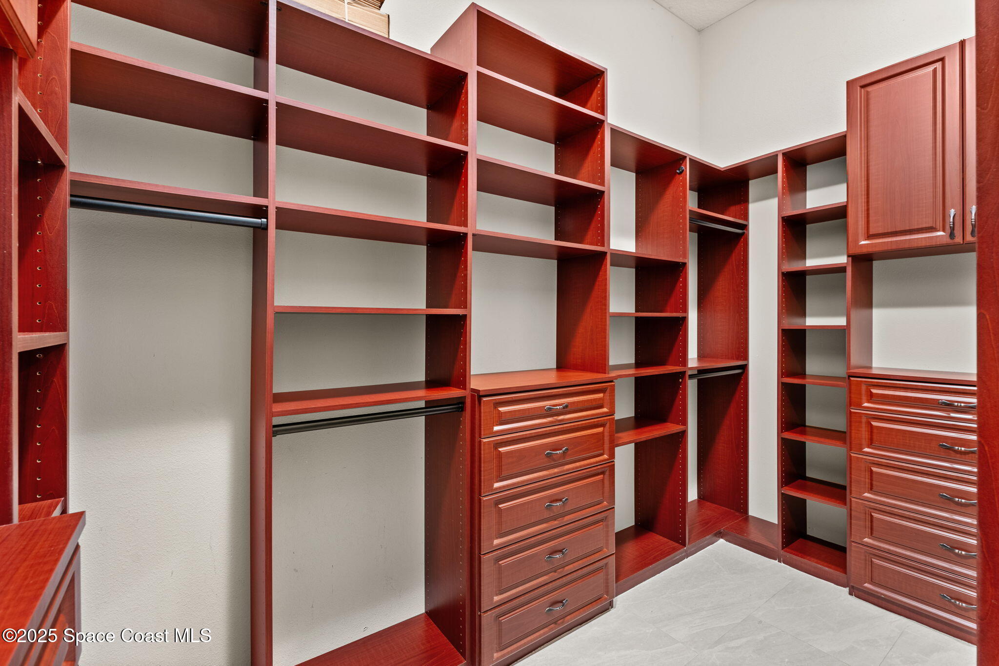 6205 Anello Drive Melbourne, FL 32940 - Photo 21 of 49 a view of walk in closet with empty racks