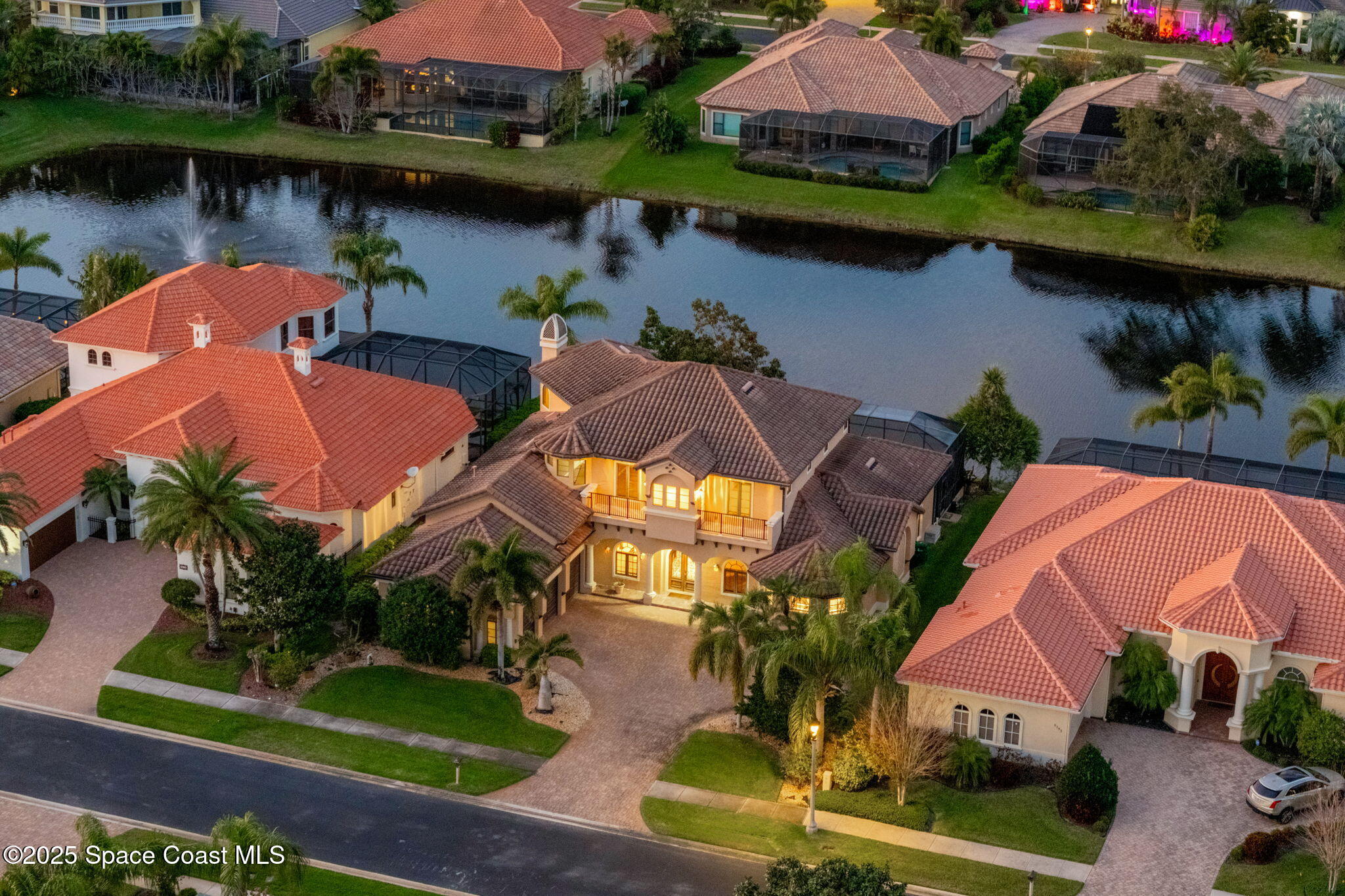 6205 Anello Drive Melbourne, FL 32940 - Photo 3 of 49 an aerial view of house with yard and lake view