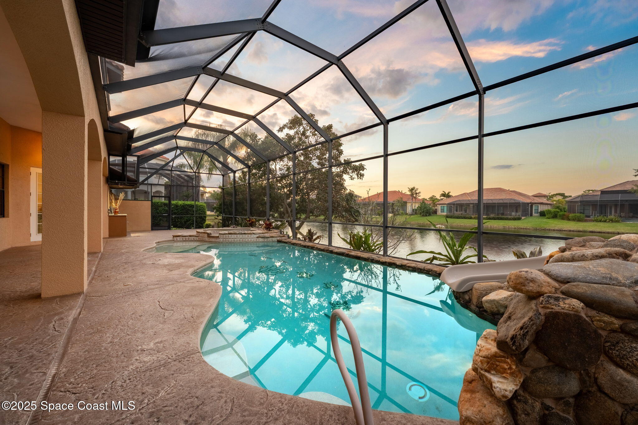 6205 Anello Drive Melbourne, FL 32940 - Photo 40 of 49 a view of swimming pool with a couches chairs and city view