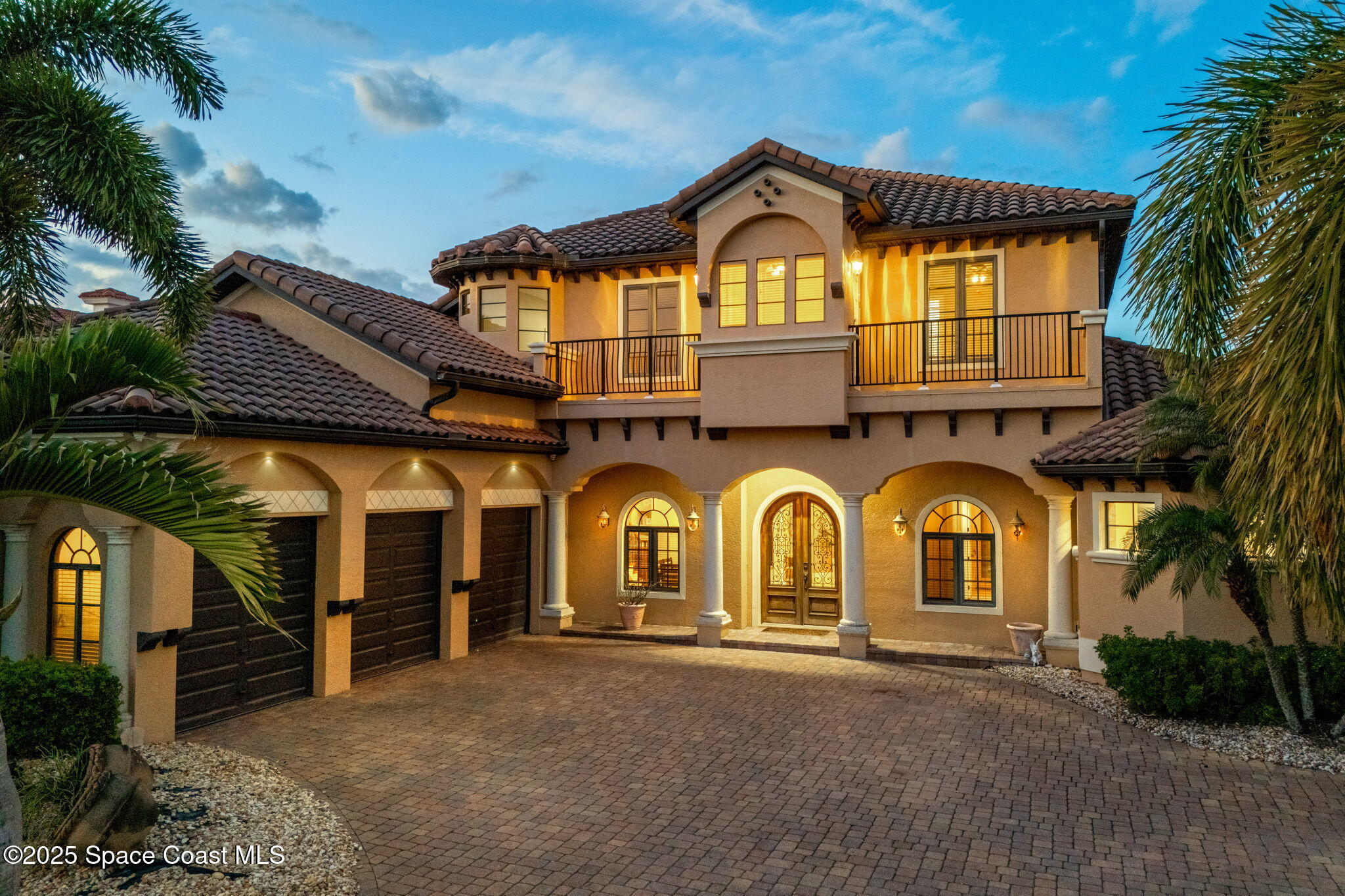 6205 Anello Drive Melbourne, FL 32940 - Photo 45 of 49 a view of a big house with a garage