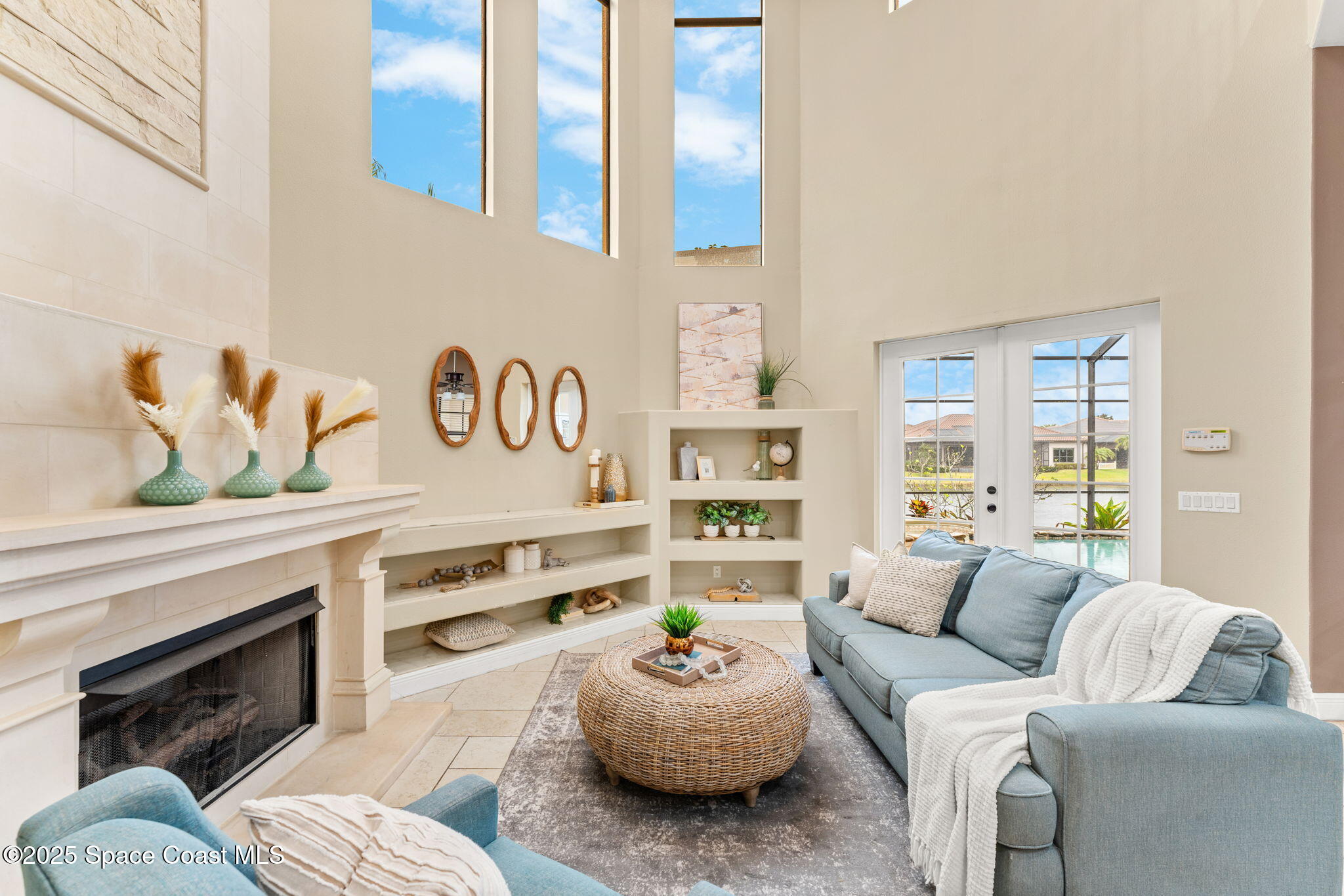 6205 Anello Drive Melbourne, FL 32940 - Photo 7 of 49 a living room with furniture kitchen and a fireplace