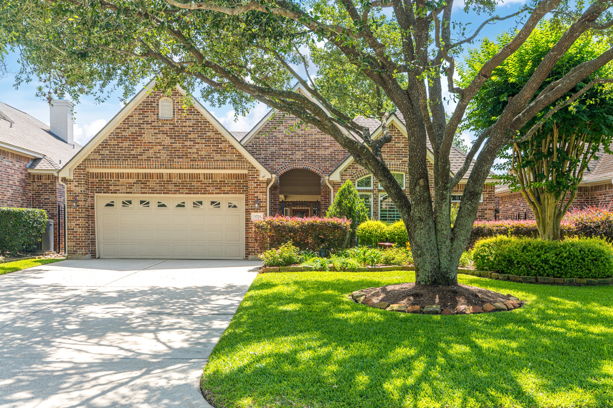20714 Flora View Court Spring, TX 77379 - Photo 1 of 40 a front view of a house with a yard and trees