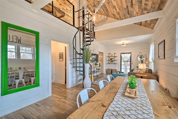 a view of a balcony with couch and wooden floor