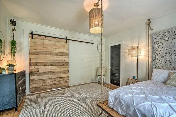 a bedroom with a bed and a walk in closet