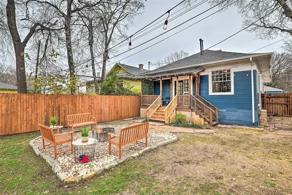 a front view of a house with a bench