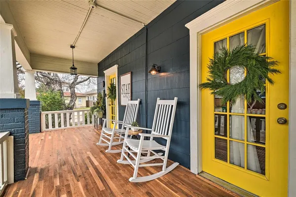 a view of balcony with wooden floor and outdoor seating