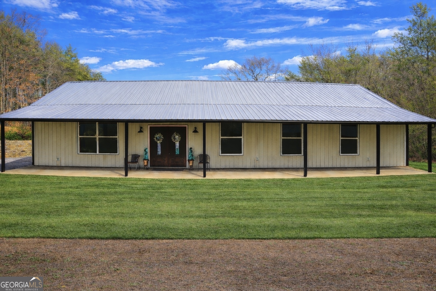 a front view of a house with a garden