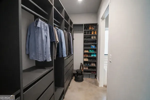 a bedroom with furniture and a window