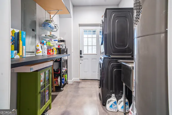 a kitchen with a sink stove and microwave