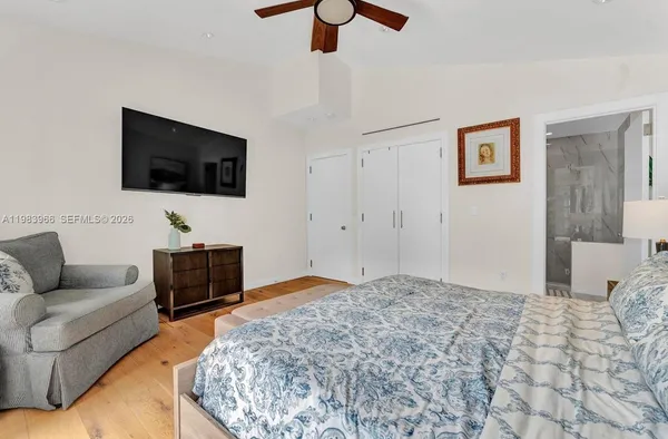 a living room with a flat screen tv and a couch