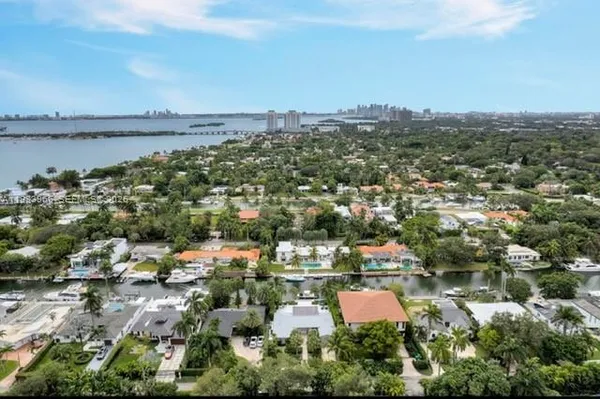 an aerial view of residential building and lake