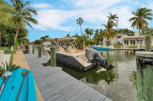 a view of a swimming pool with a table and chairs