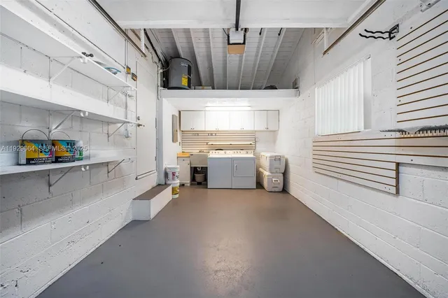 a utility room with cabinets