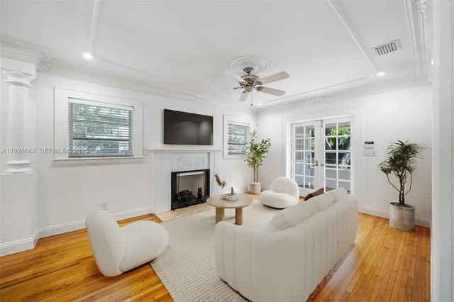 a living room with furniture fireplace and a flat screen tv