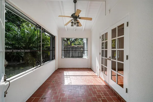 a very nice looking room with a large window and chandelier