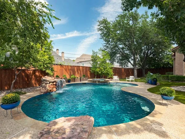 a view of a backyard with sitting area