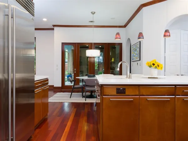 a kitchen with sink refrigerator and window