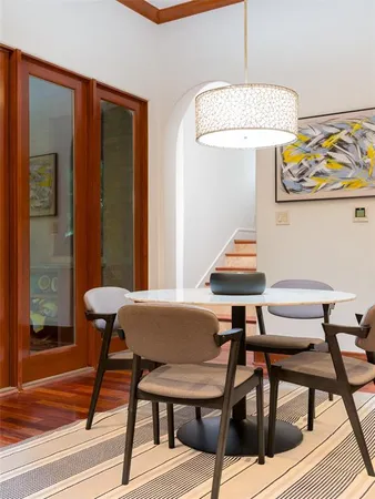 a view of a dining room with furniture and wooden floor
