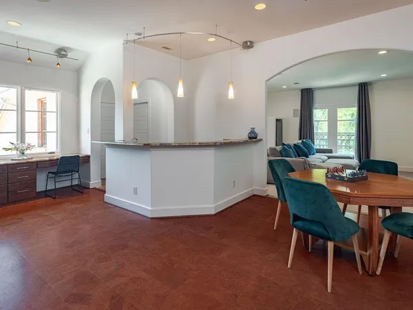 a view of a dining room with furniture and window