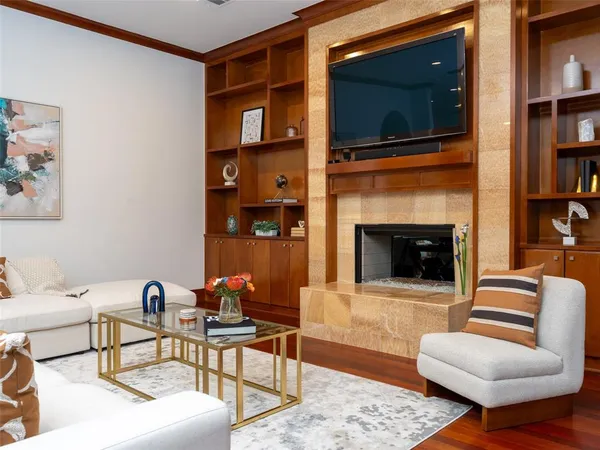 a living room with furniture and a fireplace