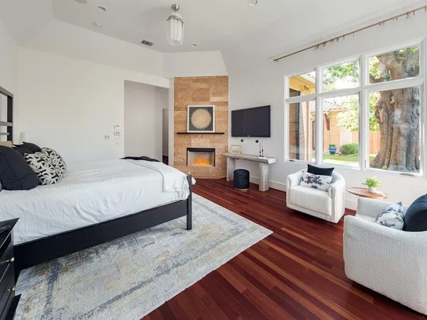 a spacious bedroom with a bed and a couch