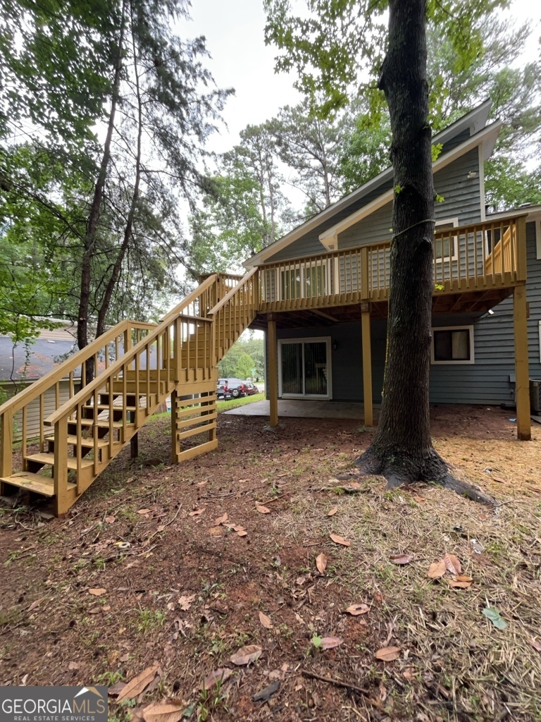 1265 Herrington Road Lawrenceville, GA 30044 - Photo 51 of 52 a view of a house with a yard