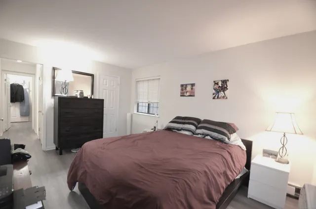 a bedroom with a bed and furniture