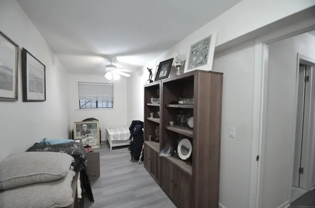 a living room with furniture and a walk in closet