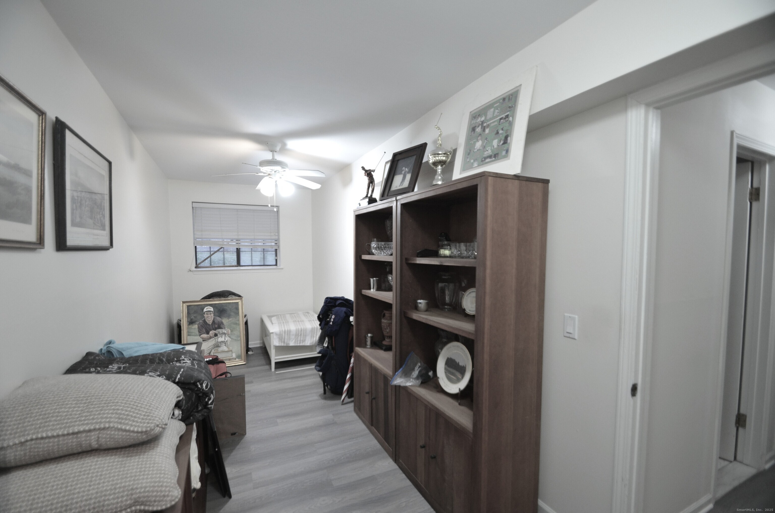 125 Warner Hill Road, Unit 27 Stratford, CT 06614 - Photo 12 of 18 a living room with furniture and a walk in closet
