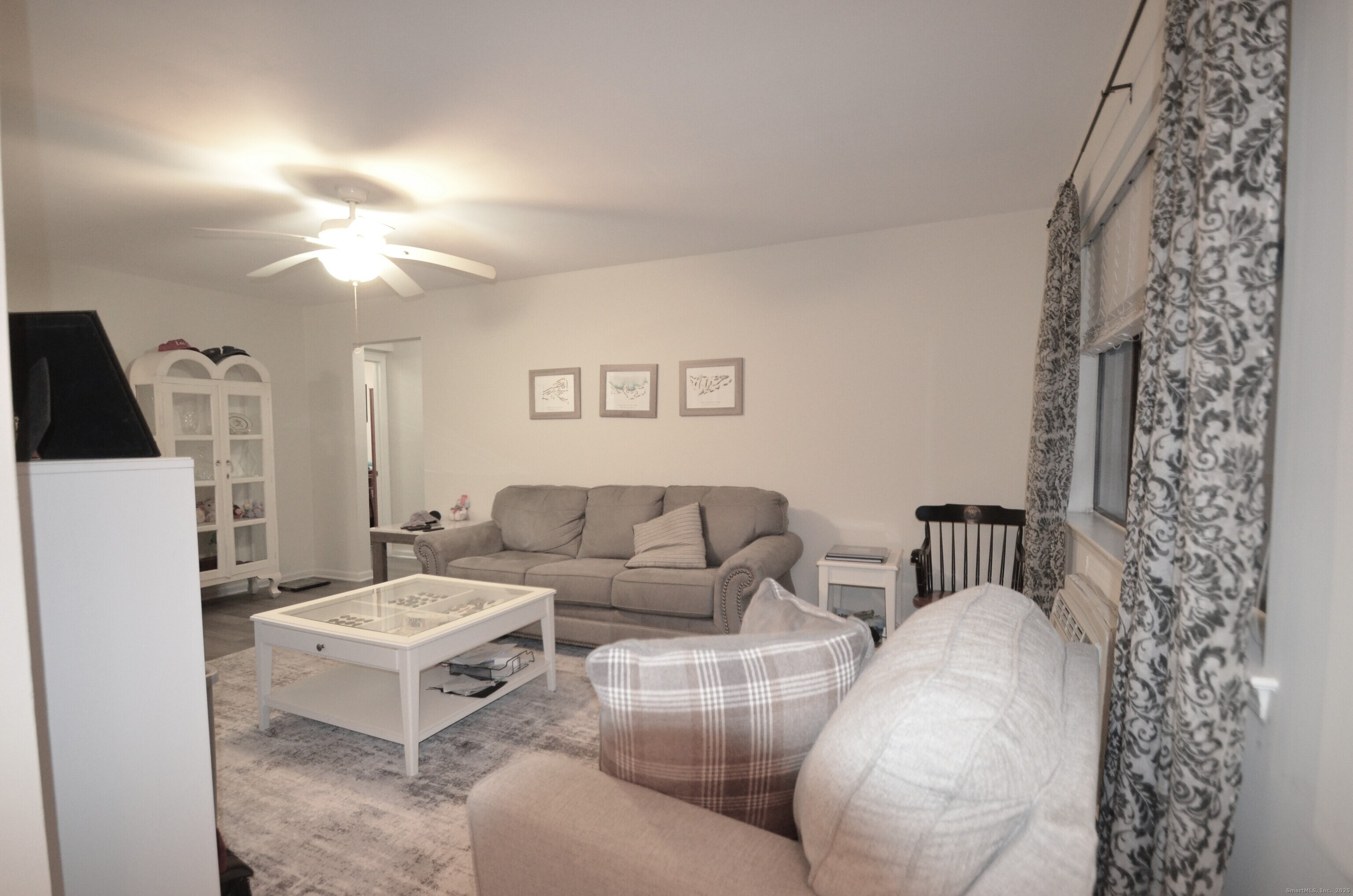 125 Warner Hill Road, Unit 27 Stratford, CT 06614 - Photo 6 of 18 a living room with furniture and a fireplace