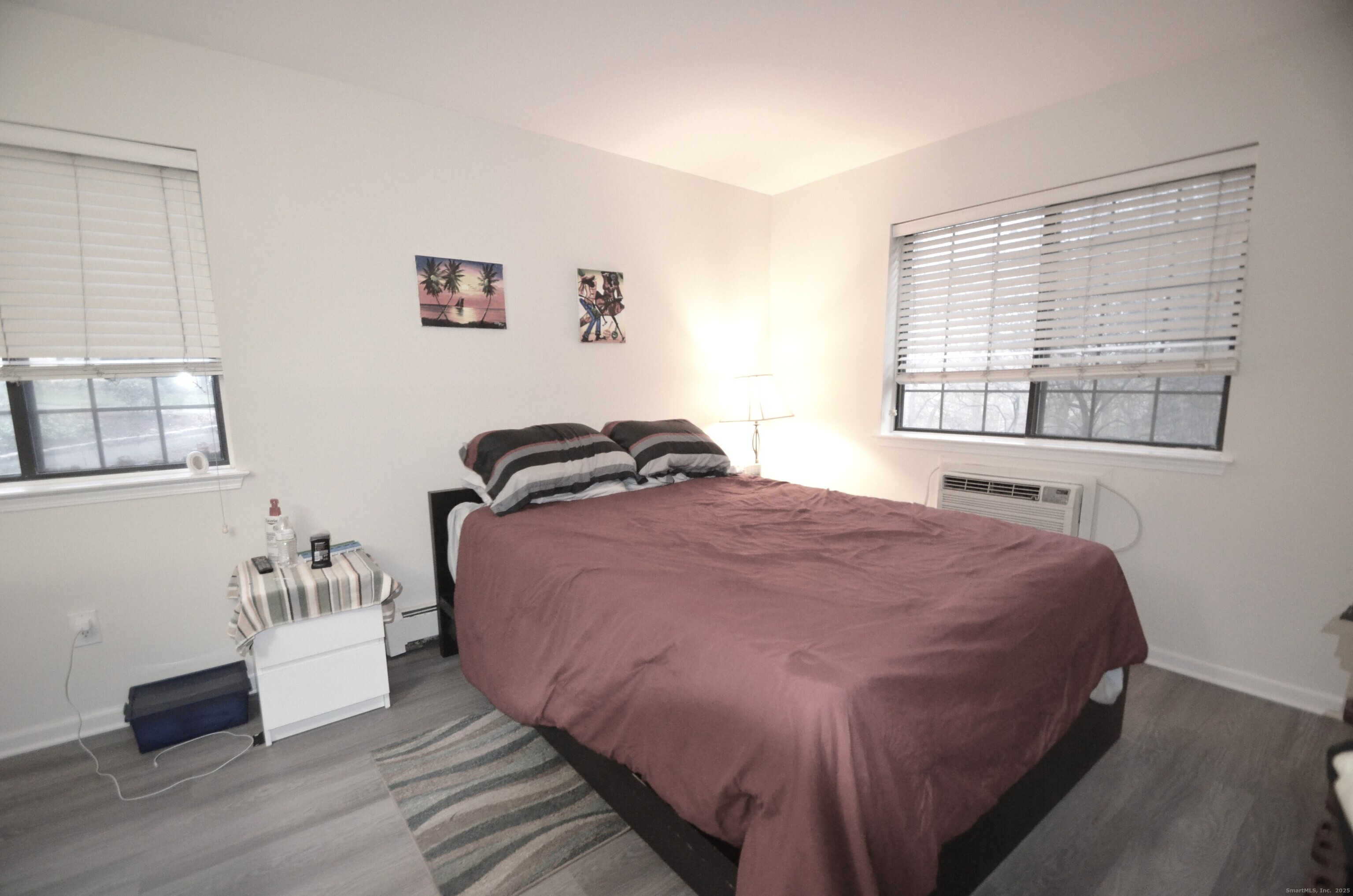 125 Warner Hill Road, Unit 27 Stratford, CT 06614 - Photo 10 of 18 a bedroom with a bed and a window