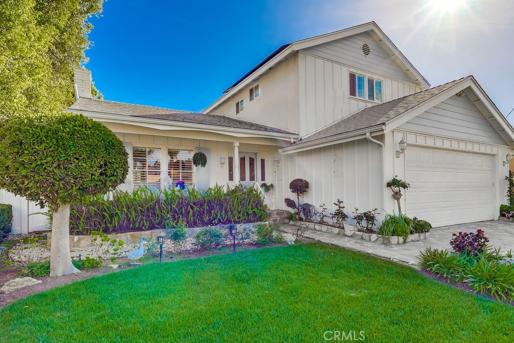a front view of house with garden