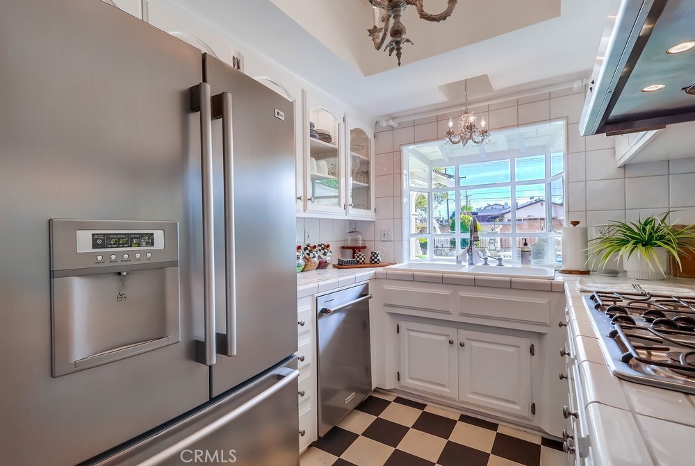 835 Statler Street San Pedro, CA 90731 - Photo 13 of 35 a kitchen with appliances cabinets and a counter top space