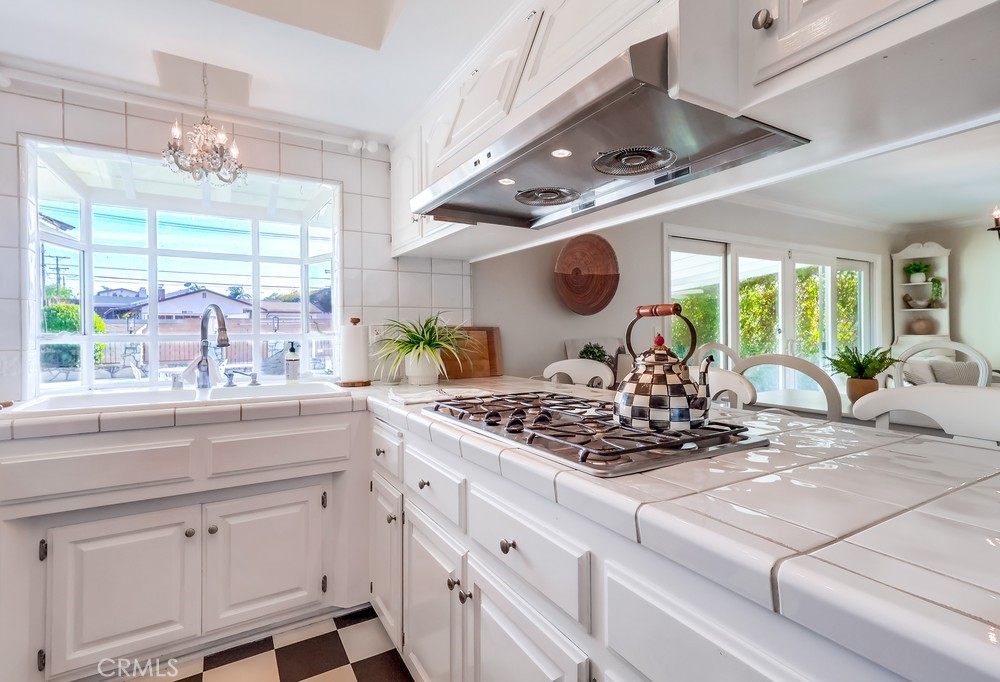 835 Statler Street San Pedro, CA 90731 - Photo 14 of 35 a kitchen with a stove and a white cabinets