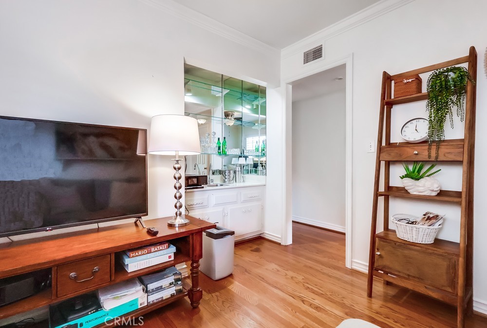 835 Statler Street San Pedro, CA 90731 - Photo 17 of 35 a room with furniture and a lamp on table with wooden floor