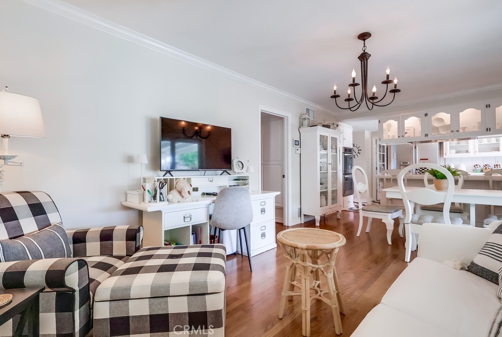 835 Statler Street San Pedro, CA 90731 - Photo 9 of 35 a living room with furniture a flat screen tv and kitchen view