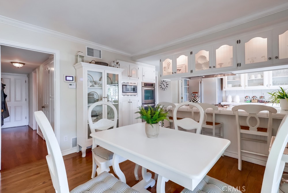 835 Statler Street San Pedro, CA 90731 - Photo 10 of 35 a view of a dining room with furniture and wooden floor
