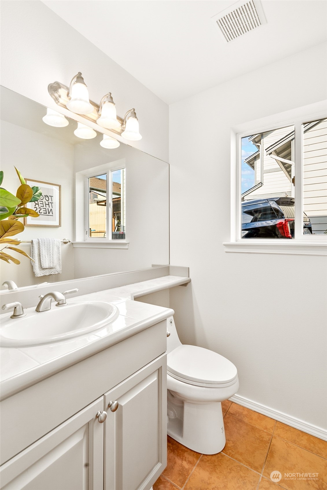 1730 Southeast 30th Place Renton, WA 98055 - Photo 14 of 31 a bathroom with a sink vanity mirror and toilet
