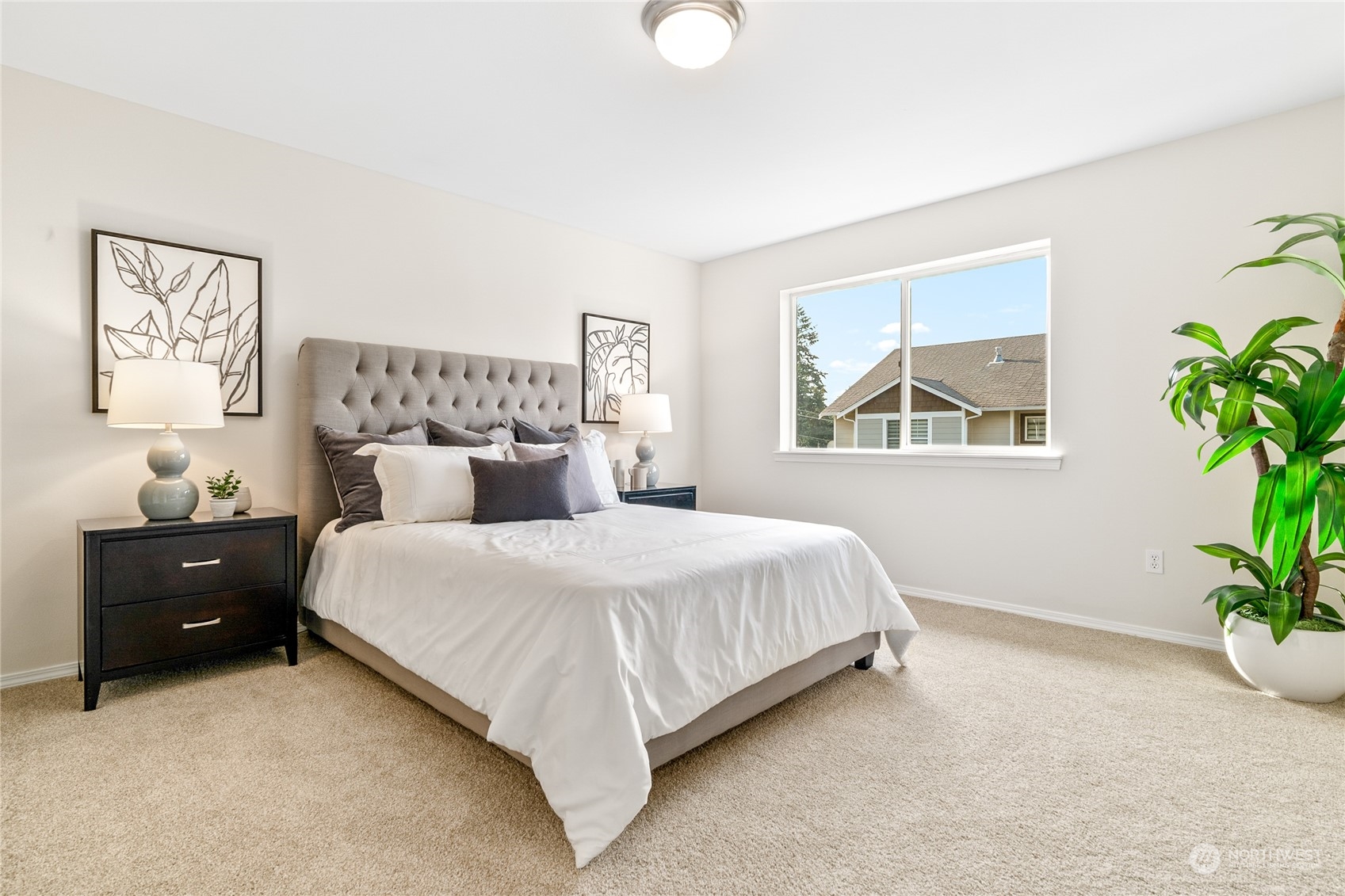 1730 Southeast 30th Place Renton, WA 98055 - Photo 15 of 31 a bedroom with a bed and a potted plant
