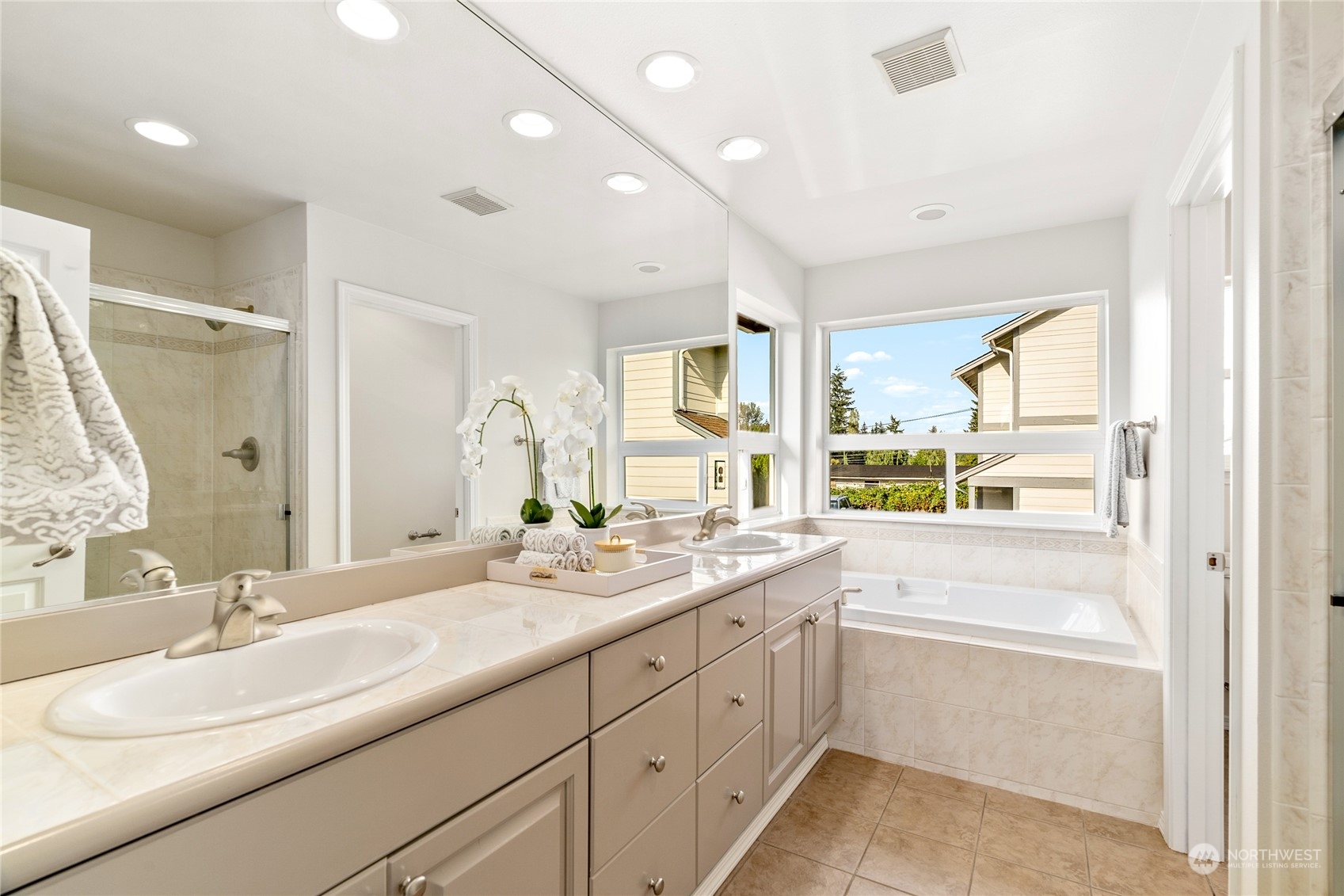 1730 Southeast 30th Place Renton, WA 98055 - Photo 18 of 31 a bathroom with a sink double vanity granite tub and a mirror