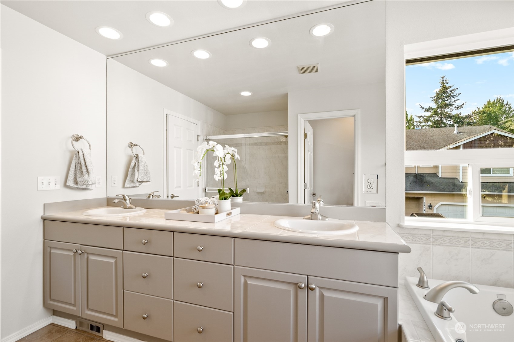 1730 Southeast 30th Place Renton, WA 98055 - Photo 19 of 31 a bathroom with a double vanity sink and a mirror