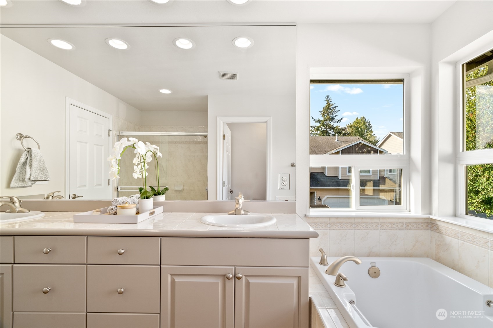 1730 Southeast 30th Place Renton, WA 98055 - Photo 20 of 31 a bathroom with a double vanity sink and a window