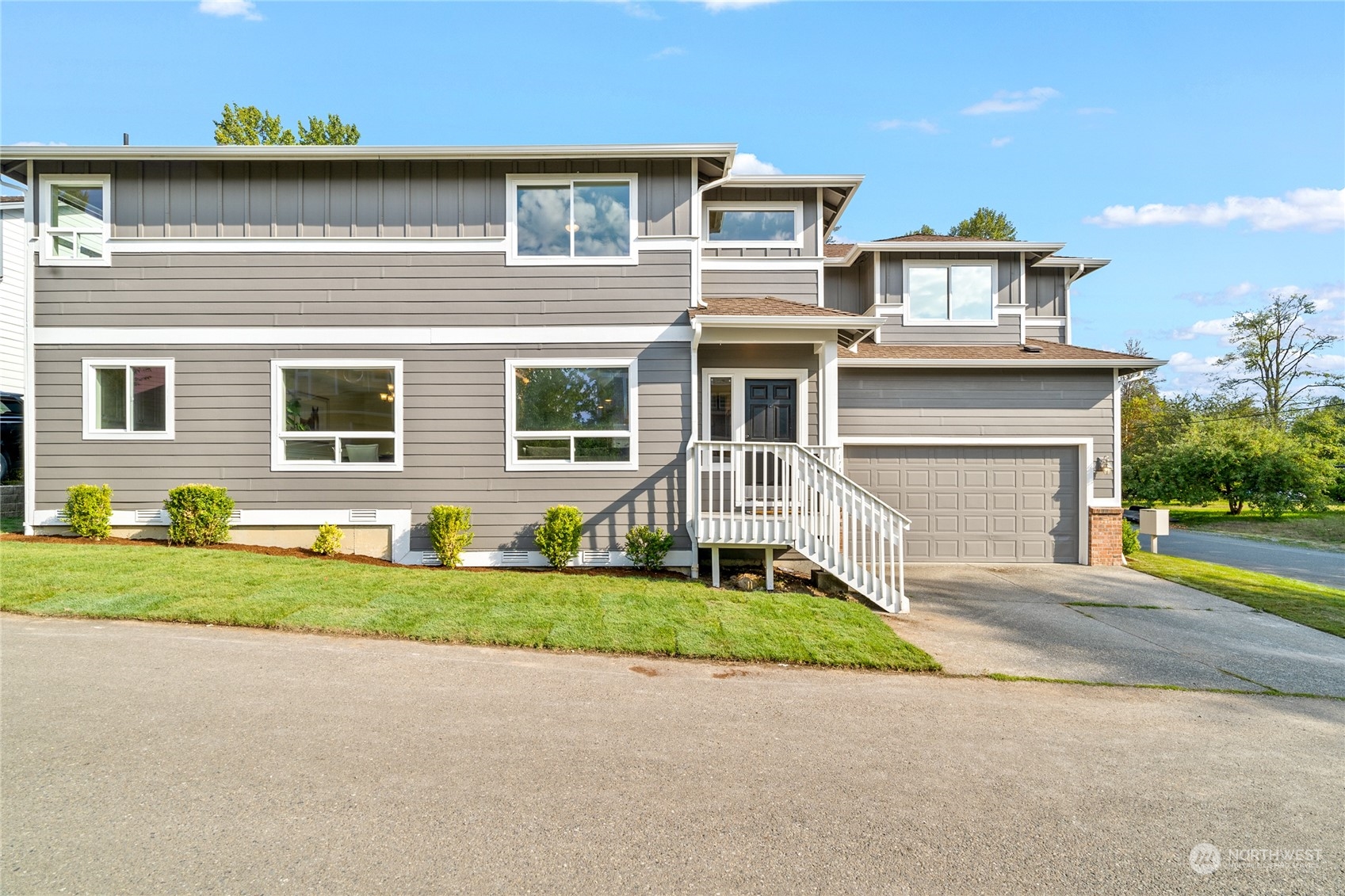 1730 Southeast 30th Place Renton, WA 98055 - Photo 2 of 31 a front view of a house with a yard and garage