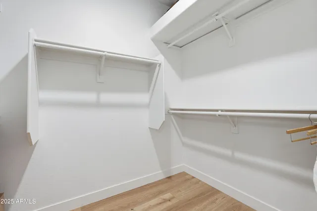 a bathroom with sink granite and a mirror