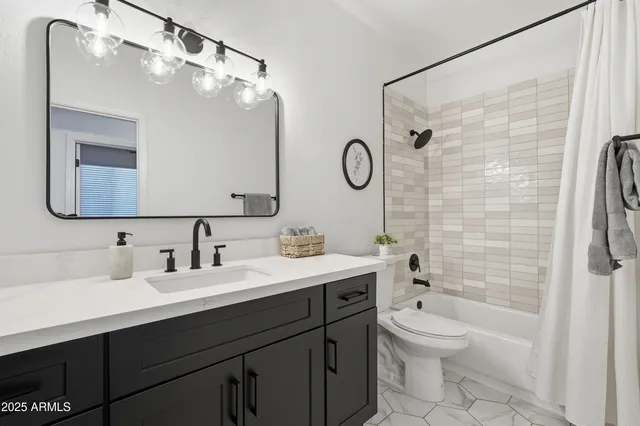 a backyard of a house with barbeque oven table and chairs